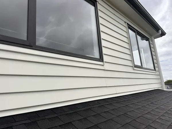 Weatherboards look clean and bright after pressure washing, free of dirt, mildew, and stains on the home's exterior.